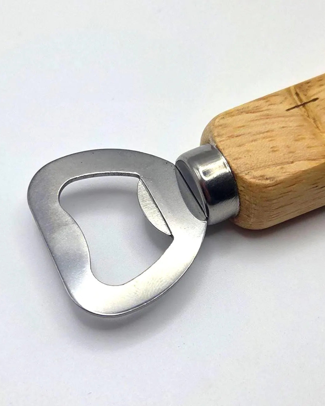 A bottle opener with a polished silver metal head and a light natural wood handle engraved with the word 'OPEN', shown on a plain white background.