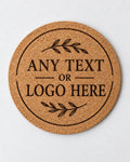 A round cork coaster with customizable black text and leaf illustrations, displayed on a clean white background.